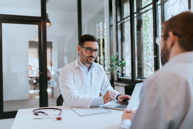 Healthcare worker listening to a client in the office.