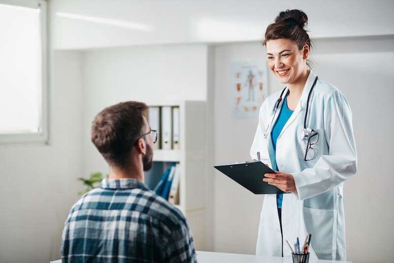 Doctor consults with patient at physical